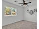 Neutral bedroom featuring a ceiling fan, carpeted floors, window with blinds and decorative wall art at 13215 N 30Th Pl, Phoenix, AZ 85032