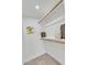 Bright walk-in closet with shelves and rods for optimal storage at 13215 N 30Th Pl, Phoenix, AZ 85032