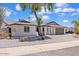 Well-maintained home featuring a neutral exterior with desert landscaping and a gray roof at 13215 N 30Th Pl, Phoenix, AZ 85032