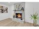 A stone fireplace with decor features a warm and inviting focal point in the living space at 13215 N 30Th Pl, Phoenix, AZ 85032
