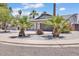 Charming home with a well-maintained front yard, decorative rocks, and mature trees at 13215 N 30Th Pl, Phoenix, AZ 85032