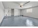 Spacious garage with finished flooring, ample storage, and convenient access doors at 13215 N 30Th Pl, Phoenix, AZ 85032