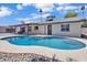 Enjoy the Arizona sunshine in this sparkling pool featuring a pebble tec surround with easy access from the home at 13215 N 30Th Pl, Phoenix, AZ 85032