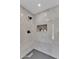 Elegant walk-in shower featuring tile surround and modern fixtures for a luxurious bathing experience at 13215 N 30Th Pl, Phoenix, AZ 85032