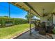 Covered patio, lawn, seating area, and lush landscaping create an inviting outdoor oasis at 1423 E 1St St, Mesa, AZ 85203