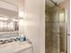 Modern bathroom with a glass-enclosed shower and a neutral color palette at 1423 E 1St St, Mesa, AZ 85203