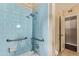 Bathroom shower features blue tile and grab bars at 1423 E 1St St, Mesa, AZ 85203