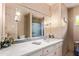 Bathroom vanity features a large mirror and updated sink at 1423 E 1St St, Mesa, AZ 85203