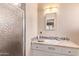 Bathroom featuring a tiled vanity and a glass shower at 1423 E 1St St, Mesa, AZ 85203