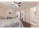 Comfortable bedroom has an ensuite bathroom and a walk-in closet at 1423 E 1St St, Mesa, AZ 85203