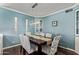 Charming dining room featuring a modern light fixture and seating for six in front of beautiful windows at 1423 E 1St St, Mesa, AZ 85203