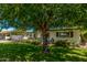 Traditional single-story home with a well-manicured lawn and mature landscaping at 1423 E 1St St, Mesa, AZ 85203