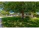 Traditional single-story home with a well-manicured lawn and mature landscaping at 1423 E 1St St, Mesa, AZ 85203
