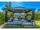 This backyard gazebo provides shade and comfortable seating, creating an ideal space for relaxation at 1423 E 1St St, Mesa, AZ 85203