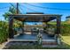 This backyard gazebo provides shade and comfortable seating, creating an ideal space for relaxation at 1423 E 1St St, Mesa, AZ 85203