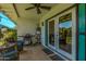 Covered patio features a grill, seating, and views of the landscaped backyard at 1423 E 1St St, Mesa, AZ 85203