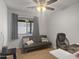 Comfortable bedroom featuring a ceiling fan, neutral paint, and a cozy futon at 14728 W Redfield Rd, Surprise, AZ 85379