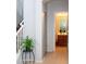 Hallway view of an updated bathroom with wood cabinets and modern lighting at 15148 W Sells Dr, Goodyear, AZ 85395