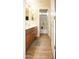 Bathroom with wood-look tile flooring and dual sinks at 15148 W Sells Dr, Goodyear, AZ 85395