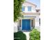 Inviting entrance showcasing a double door and manicured shrubbery at 15148 W Sells Dr, Goodyear, AZ 85395