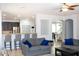 Bright and spacious living room with a breakfast bar and open access to the kitchen area at 15148 W Sells Dr, Goodyear, AZ 85395
