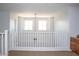 Bright loft area with plush carpet, white railing, and abundant natural light through well-placed windows at 15148 W Sells Dr, Goodyear, AZ 85395