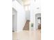 Bright foyer with an open staircase and neutral color palette at 15148 W Sells Dr, Goodyear, AZ 85395