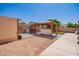 Backyard featuring a covered patio, a shed, and a gravel area, creating a versatile outdoor space at 17693 W Lincoln St, Goodyear, AZ 85338