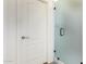 Bathroom features a frosted glass door, white door, and tile flooring at 17693 W Lincoln St, Goodyear, AZ 85338