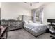 Bedroom with gray carpet, a ceiling fan, and a gray bed at 17693 W Lincoln St, Goodyear, AZ 85338