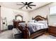 Bedroom showcasing a wooden bed frame with matching furniture and a stylish ceiling fan at 17693 W Lincoln St, Goodyear, AZ 85338