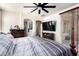 Bedroom view showcasing ceiling fan, bed, and dresser with sliding glass doors to outdoor area at 17693 W Lincoln St, Goodyear, AZ 85338