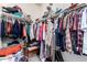 Walk-in closet filled with clothes and storage containers for organized living at 17693 W Lincoln St, Goodyear, AZ 85338