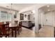 Open floor plan featuring a dining room and living room area with archways and dark flooring at 17693 W Lincoln St, Goodyear, AZ 85338