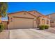 Charming single-story home with a well-maintained front yard, desert landscaping, and two-car garage at 17693 W Lincoln St, Goodyear, AZ 85338