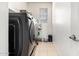 Laundry room featuring a side-by-side washer and dryer at 17693 W Lincoln St, Goodyear, AZ 85338