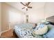 Bedroom with ceiling fan, carpet and double-door closet at 17975 W Willow Dr, Goodyear, AZ 85338