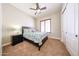 Bedroom with ceiling fan, plantation shutters, and carpet at 17975 W Willow Dr, Goodyear, AZ 85338