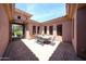Enclosed courtyard with outdoor seating area and landscaped features for private relaxation and enjoyment at 17975 W Willow Dr, Goodyear, AZ 85338
