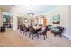 Spacious dining room with a wooden table and chairs, decorative accents, and open layout at 17975 W Willow Dr, Goodyear, AZ 85338