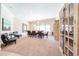 Carpeted dining room featuring a large window and decorative cabinet at 17975 W Willow Dr, Goodyear, AZ 85338