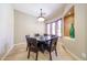 Comfortable dining area with a table, seating for six, and view of other rooms at 17975 W Willow Dr, Goodyear, AZ 85338