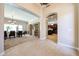Inviting entryway showcasing tile floors leading to the dining room and kitchen at 17975 W Willow Dr, Goodyear, AZ 85338