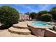Relaxing hot tub with flagstone surround and nearby desert landscaping at 17975 W Willow Dr, Goodyear, AZ 85338