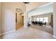 Spacious entryway view into the living room, and dining area, creating an open and inviting atmosphere at 17975 W Willow Dr, Goodyear, AZ 85338