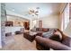 Comfortable living room with open concept to the kitchen area and nice, neutral carpet at 17975 W Willow Dr, Goodyear, AZ 85338