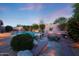 Outdoor living at its finest with a pool, a built-in BBQ, a fireplace, and a dining area, perfect for entertaining at 17975 W Willow Dr, Goodyear, AZ 85338