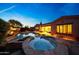 Inviting backyard pool and spa with beautiful landscaping and a seamless transition to indoor living at 17975 W Willow Dr, Goodyear, AZ 85338