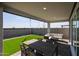 This backyard features a covered patio, outdoor seating and artificial turf at 18134 W Creedance Blvd, Surprise, AZ 85387