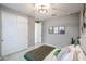 Bedroom with large closet and desert artwork and decor at 18134 W Creedance Blvd, Surprise, AZ 85387
